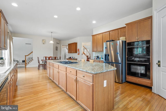 17 Grant Dr, Cream Ridge, NJ 08514 - kitchen featuring stainless steel appliances, a center island, light wood-style floors, light stone counters, and recessed lighting