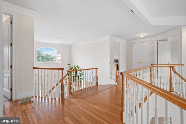 17 Grant Dr, Cream Ridge, NJ 08514 - hallway with an upstairs landing, light wood-style floors, a chandelier, and crown molding