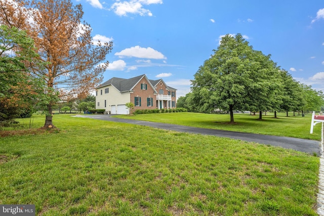 17 Grant Dr, Cream Ridge, NJ 08514 - view of front of home with an attached garage, a front lawn, and asphalt driveway