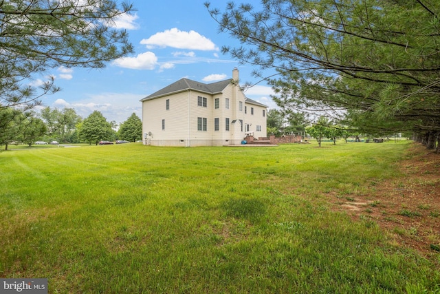 17 Grant Dr, Cream Ridge, NJ 08514 - back of property featuring a chimney and a lawn
