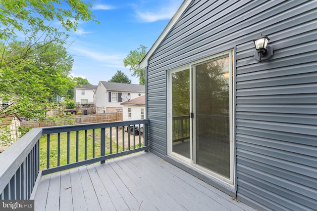 wooden deck with a residential view