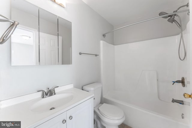 full bath featuring washtub / shower combination, toilet, and vanity
