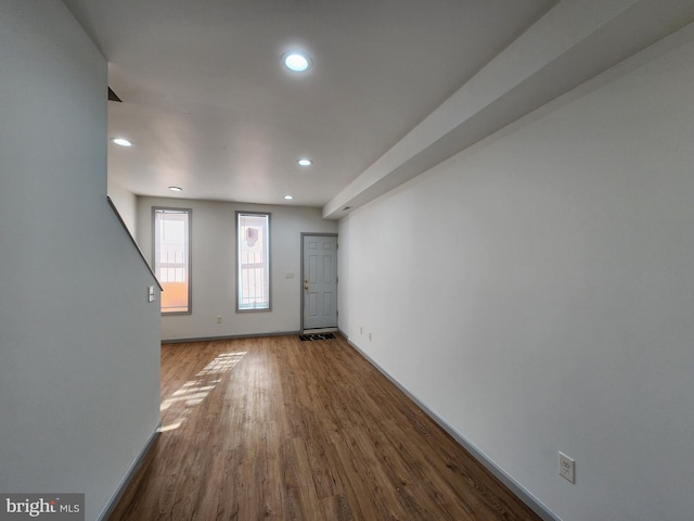 interior space with recessed lighting, baseboards, and wood finished floors