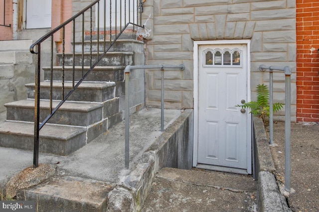 entrance to property with stone siding