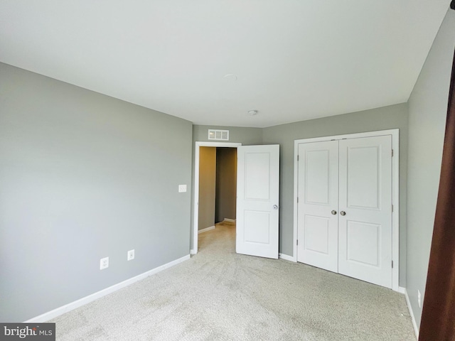 419 Foxglove Way Unit 106, Stafford, VA 22554 - unfurnished bedroom with baseboards, carpet, a closet, and visible vents