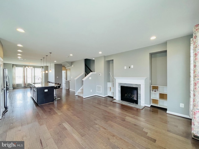 419 Foxglove Way Unit 106, Stafford, VA 22554 - living area with recessed lighting, wood finished floors, and stairway