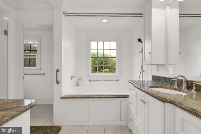 2812 Pheasant Ln, Clarksburg, MD 20871 - bathroom featuring tile patterned floors, vanity, a garden tub, and ornamental molding
