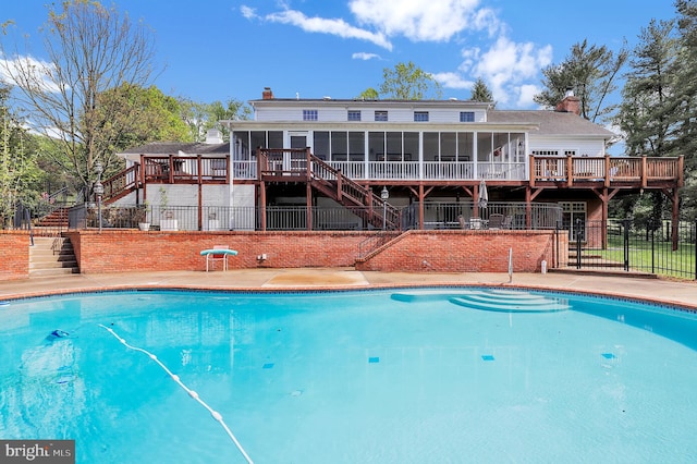 2812 Pheasant Ln, Clarksburg, MD 20871 - outdoor pool with stairway, a sunroom, fence, and a wooden deck