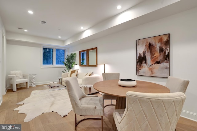 dining area featuring recessed lighting, visible vents, and light wood-style floors