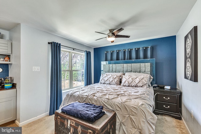 bedroom with carpet flooring, baseboards, and ceiling fan