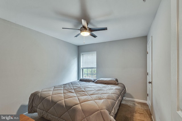 carpeted bedroom with baseboards and a ceiling fan