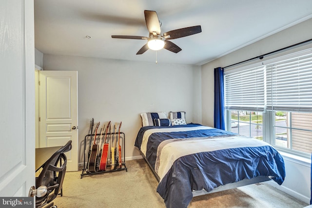 bedroom with carpet flooring, baseboards, and ceiling fan
