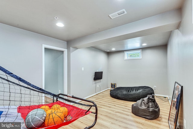 game room featuring wood finished floors, recessed lighting, and baseboards