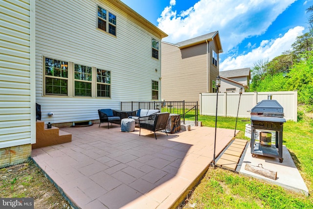 view of patio with outdoor lounge area and fence