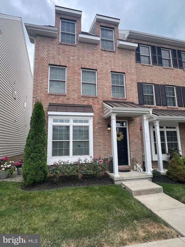 602 D St, Kennett Square, PA 19348 - townhome / multi-family property featuring a front lawn and brick siding