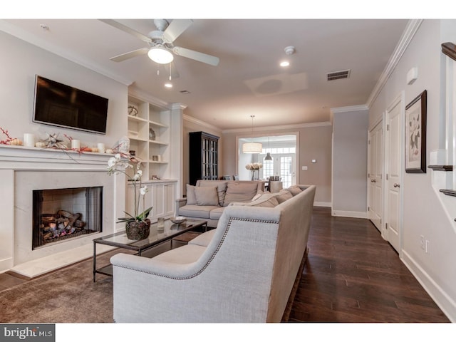602 D St, Kennett Square, PA 19348 - living area with visible vents, ornamental molding, dark wood-style flooring, and a high end fireplace