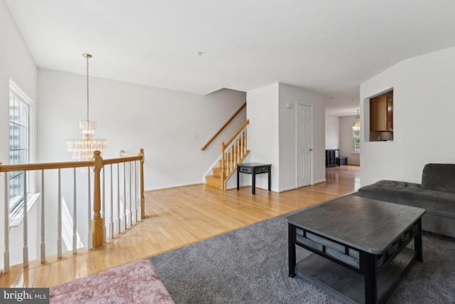 11408 Leland Pl, Waldorf, MD 20601 - living room with light wood-type flooring and a chandelier