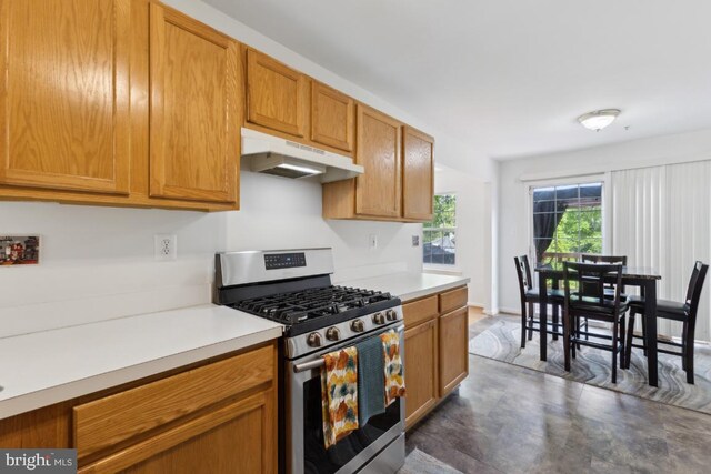 11408 Leland Pl, Waldorf, MD 20601 - kitchen featuring stainless steel gas range, under cabinet range hood, light countertops, and brown cabinetry