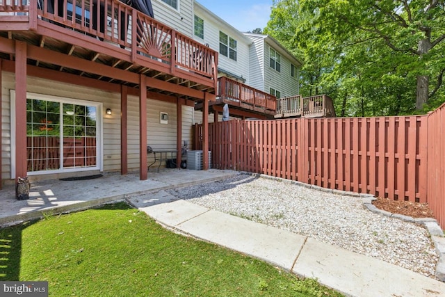 11408 Leland Pl, Waldorf, MD 20601 - fenced backyard with a wooden deck and a patio area