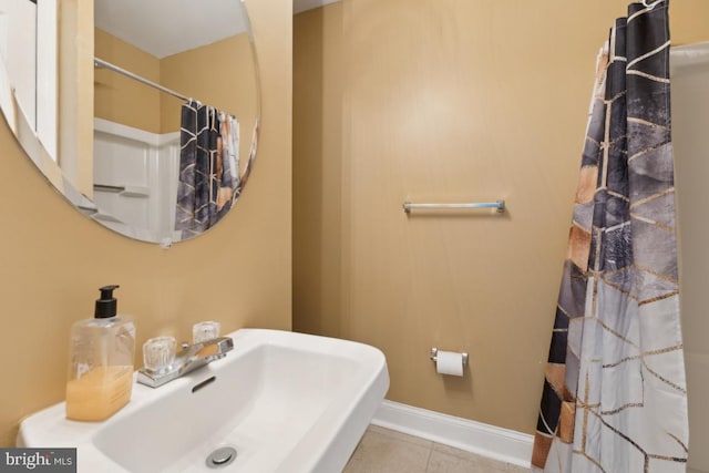 11408 Leland Pl, Waldorf, MD 20601 - bathroom with a sink, tile patterned flooring, a shower with shower curtain, and baseboards