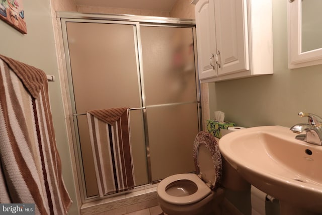 3901 Stoneybrook Rd, White Plains, MD 20695 - bathroom with a sink, a stall shower, and toilet