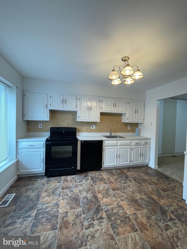 218 Keats Ct, Sicklerville, NJ 08081 - kitchen featuring visible vents, a sink, light countertops, black appliances, and a notable chandelier