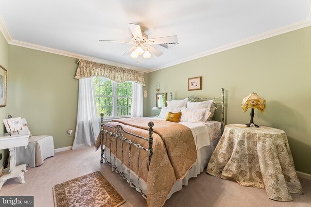 bedroom featuring carpet, crown molding, baseboards, and a ceiling fan