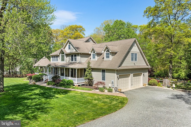 view of front of property with asphalt driveway, a front yard, roof with shingles, a porch, and a garage