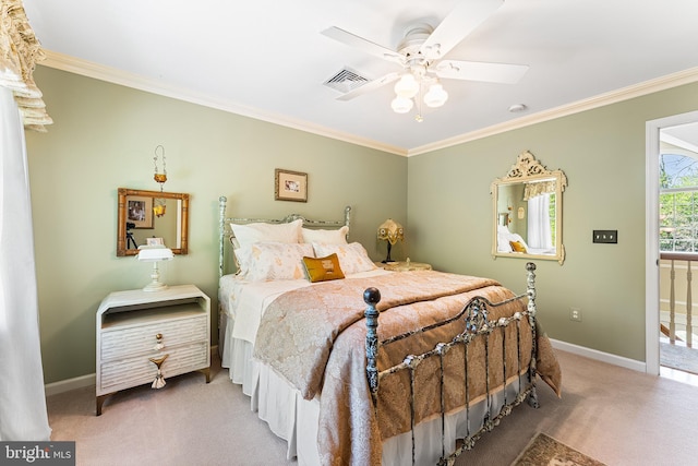 carpeted bedroom featuring ornamental molding, baseboards, and ceiling fan