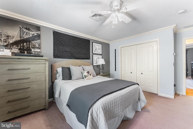 bedroom with ornamental molding, carpet flooring, a closet, baseboards, and ceiling fan