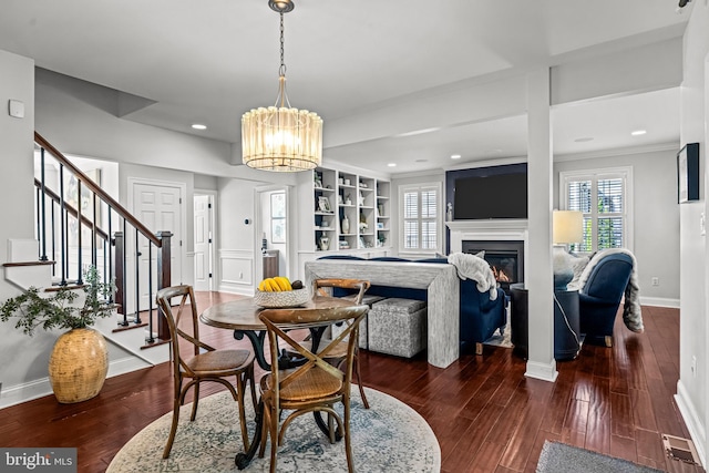 dining area with stairway, plenty of natural light, dark wood-style flooring, recessed lighting, and crown molding