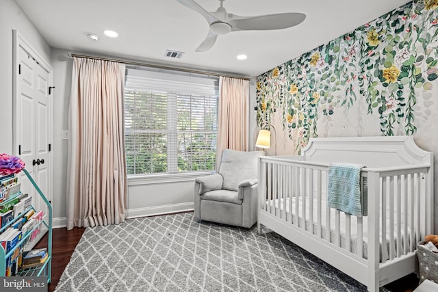 bedroom with baseboards, recessed lighting, wood finished floors, wallpapered walls, and ceiling fan