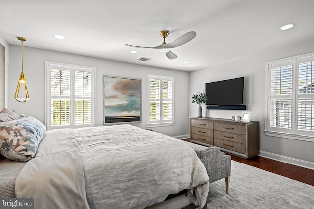 bedroom with baseboards, dark wood-type flooring, recessed lighting, and a ceiling fan