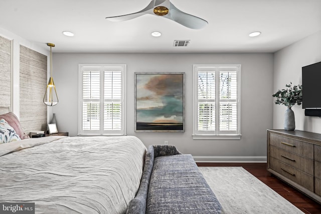 bedroom featuring dark wood-type flooring, recessed lighting, ceiling fan, and baseboards