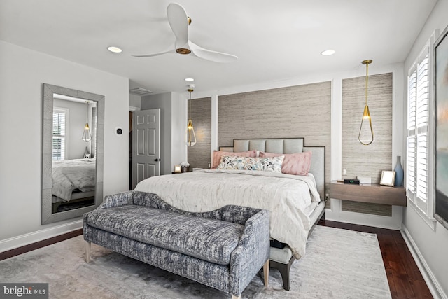 bedroom featuring multiple windows, recessed lighting, baseboards, and wood finished floors