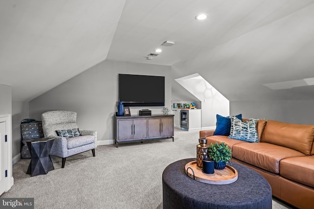 living room featuring light colored carpet, lofted ceiling, baseboards, recessed lighting, and beverage cooler