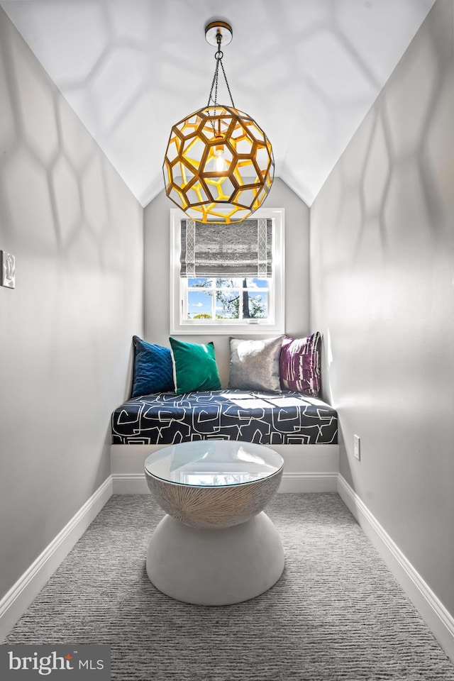 sitting room with lofted ceiling, carpet flooring, and baseboards