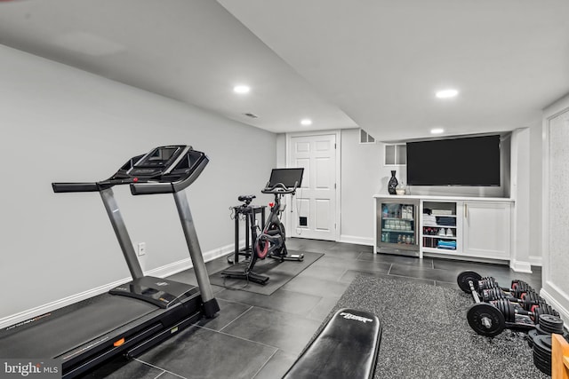 workout area with recessed lighting and baseboards