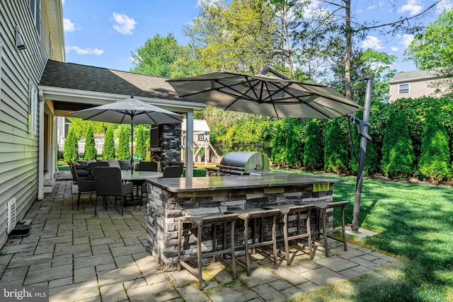 view of patio with a grill and exterior kitchen
