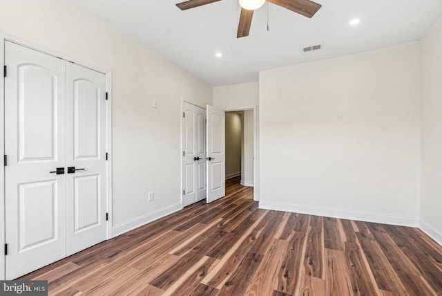 1107 S Divinity St, Philadelphia, PA 19143 - unfurnished bedroom with visible vents, wood finished floors, baseboards, ceiling fan, and recessed lighting
