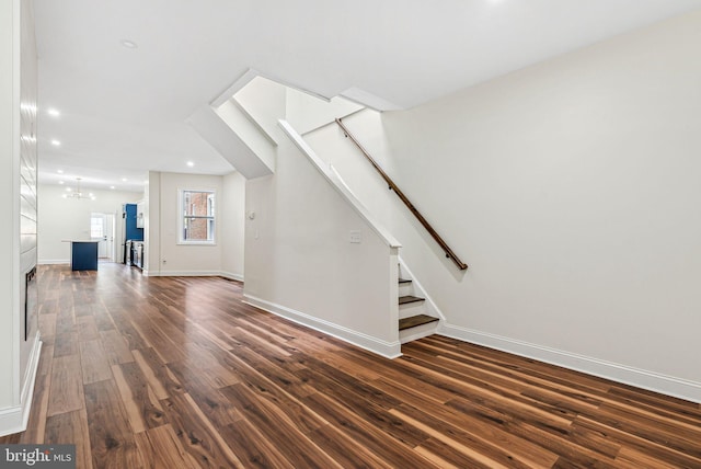 1107 S Divinity St, Philadelphia, PA 19143 - unfurnished living room featuring dark wood-style flooring, a chandelier, stairs, recessed lighting, and baseboards