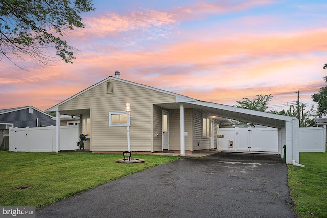 6 Swan Ln, Levittown, PA 19055 - view of front facade with a gate, asphalt driveway, and a carport