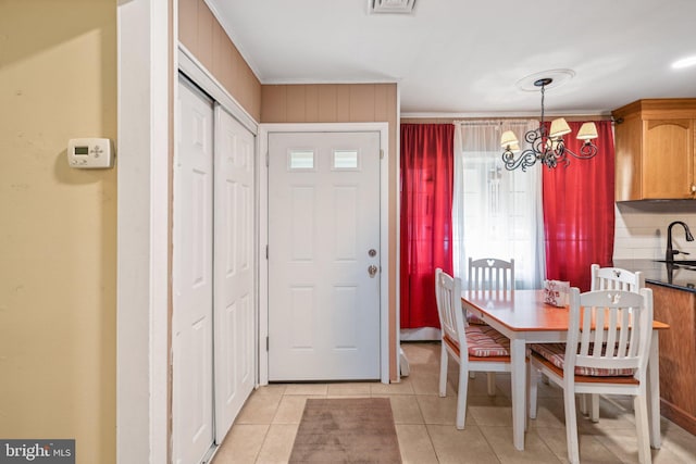 6 Swan Ln, Levittown, PA 19055 - dining room with light tile patterned floors and a chandelier