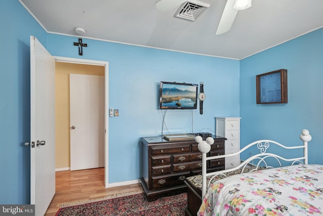 6 Swan Ln, Levittown, PA 19055 - bedroom with wood finished floors, ceiling fan, and baseboards