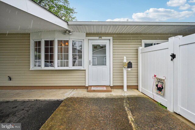 6 Swan Ln, Levittown, PA 19055 - view of exterior entry featuring fence