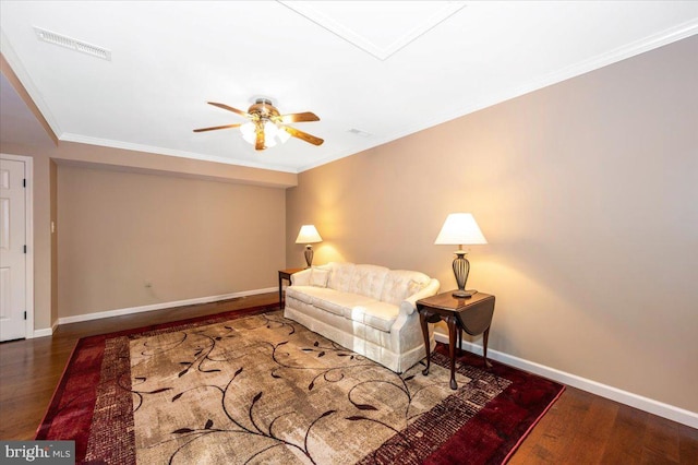 living room with baseboards, ceiling fan, wood finished floors, and visible vents