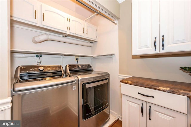 clothes washing area featuring laundry area and washing machine and dryer