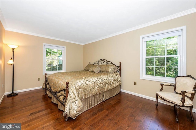 bedroom with baseboards, ornamental molding, and hardwood / wood-style floors