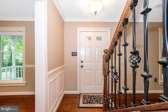 entrance foyer featuring crown molding and dark wood-style floors