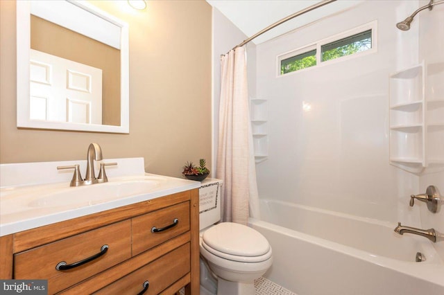 bathroom featuring vanity, toilet, and shower / tub combo